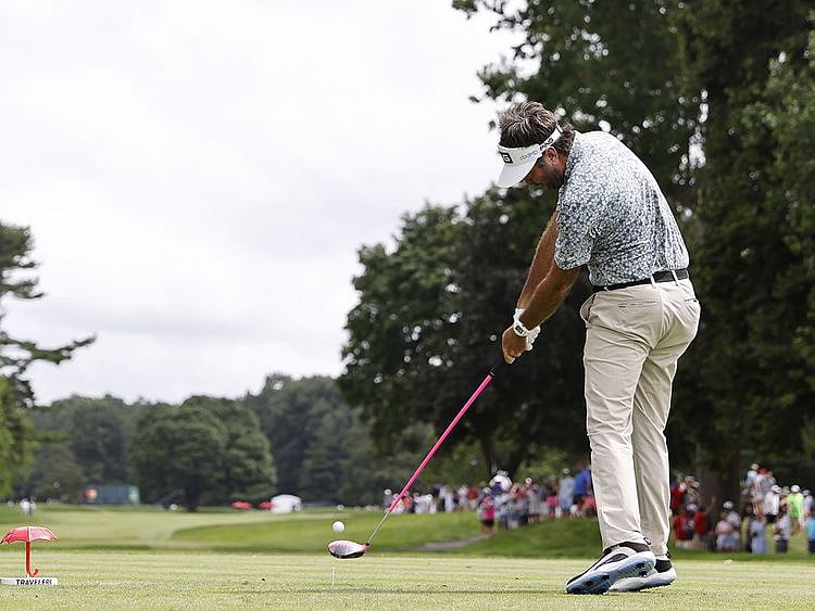 Bubba Watson plays his shot from the sixth tee during the third round of the Travelers Championship at TPC River Highlands 