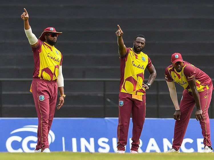Kieron Pollard, Andre Russell and Jason Holder of West Indies set the field against South Africa 