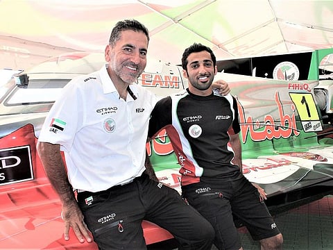 Team Abu Dhabi manager Guido Cappellini with Rashed Al Qemzi.