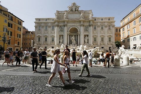 Visitors near Trevi fountain in Trevi district in Rome on June 28, 2021. 