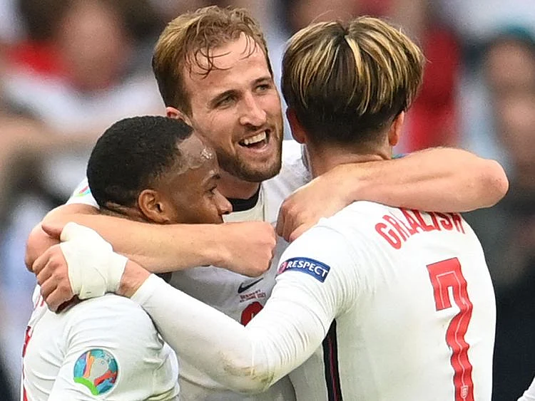 England's Harry Kane celebrates with Raheem Sterling and Jack Grealish after their win over Germany.