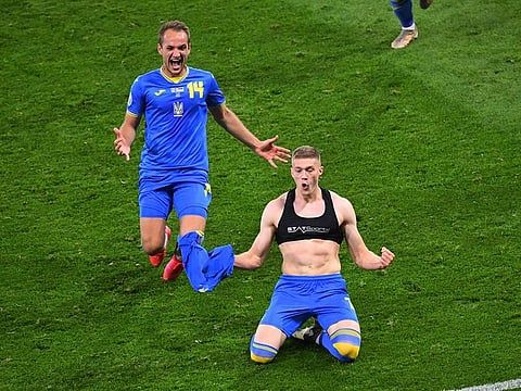 Ukraine's Artem Dovbyk celebrates scoring their second goal with Yevhenii Makarenko.