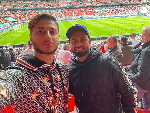 Time off: Rishabh Pant (right) with a friend at the England-Germany match at Wembley on Tuesday.