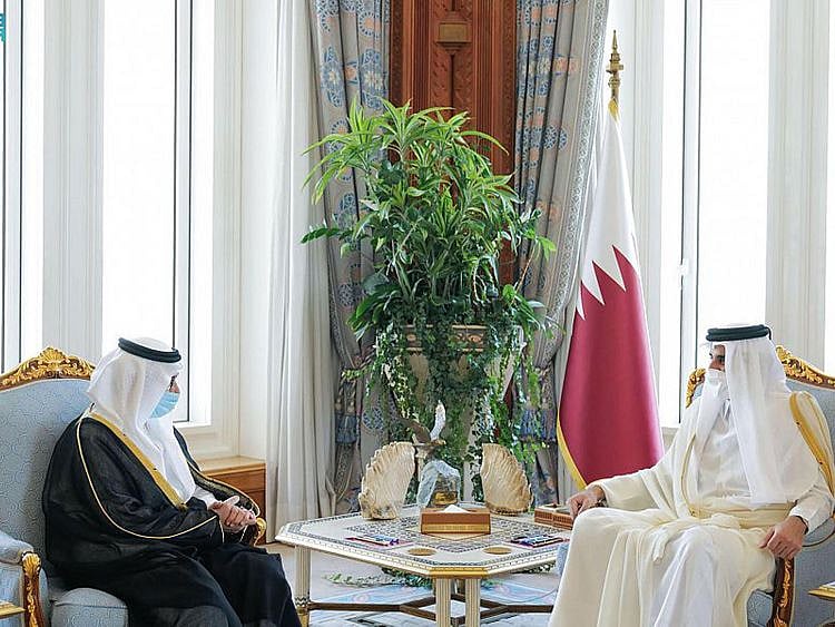 Qatari Emir Tamim Bin Hamad (right) meets the new Saudi ambassador to Doha. 