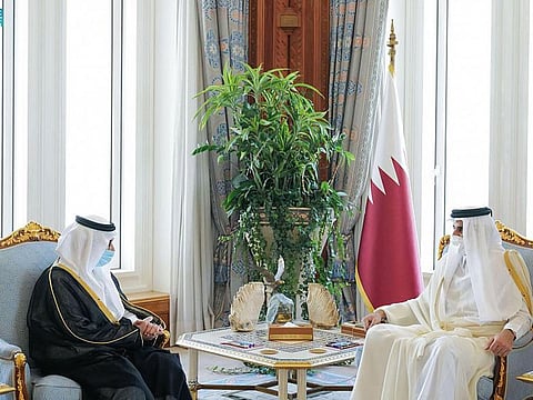 Qatari Emir Tamim Bin Hamad (right) meets the new Saudi ambassador to Doha. 