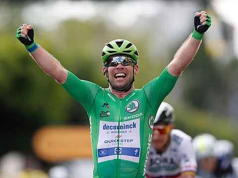 Mark Cavendish crosses the line to win Stage 6 of the 2021 Tour de France.