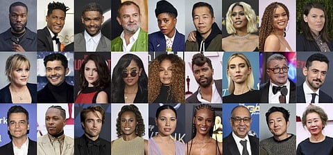 This combination photo shows some of the 395 artists who are invited to join the Academy of Motion Picture Arts and Sciences, top row from left, Yahya Abdul-Mateen II, Jon Batiste, Kingsley Ben-Adir, Hugh Bonneville, Janicza Bravo, Lee Isaac Chung, Laverne Cox, Andra Day and Clea DuVall, middle row from left, Emerald Fennell, Henry Golding, Eiza González, H.E.R., Janet Jackson, Shaka King, Vanessa Kirby, Nathan Lane and Luis Gerardo Méndez and bottom row from left, Wagner Moura, Leslie Odom Jr., Robert Pattinson, Issa Rae, Jurnee Smollett, Tiara Thomas, George C. Wolfe, Steven Yeun and Youn Yuh-jung.