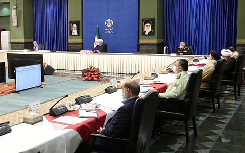 Iran's President Hassan Rouhani (second left) attending a meeting in the capital Tehran on July 3, 2021. 
