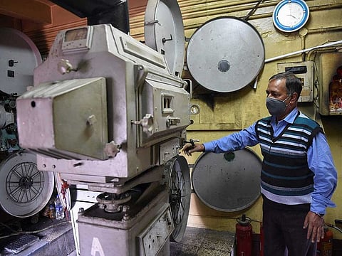 In this photograph taken on August 29, 2020, a projectionist works in a projector room at the Shahi Theatre in Shimla. With its ancient humming projector and elegant balcony, the Shahi Theatre is the last surviving single-screen cinema in Shimla, the Himalayan hill station that was once the summer retreat of British India. 