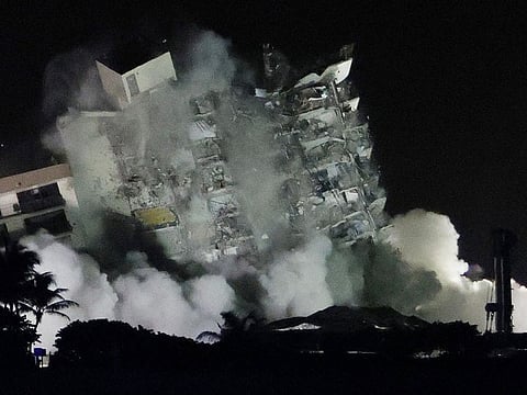 The remaining part of the partially collapsed 12-story Champlain Towers South condo building fell in a controlled demolition on July 4, 2021 in Surfside, Florida. 