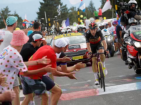 Team Jumbo–Visma rider Wout van Aert crosses the finish line to win stage 11 of the Tour de France