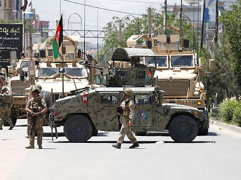 Afghan security forces stand guard outside a hospital which came under attack in Kabul in a file photo.
