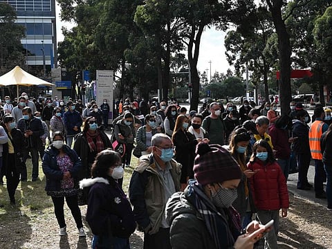 Sydneysiders wait outside a COVID-19 vaccination centre in the Homebush suburb of Sydney on July 7, 2021.