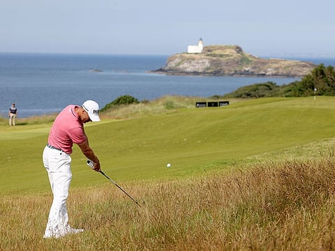 Germany's Martin Kaymer plays a shot from the rough
