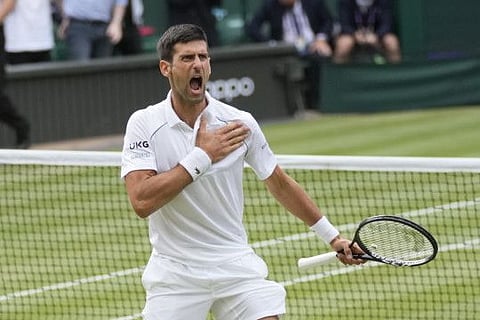 Serbia's Novak Djokovic celebrates after defeating Canada's Denis Shapovalov during the men's singles semifinals match at Wimbledon. He faces seventh seed Matteo Berrettini today in the final.