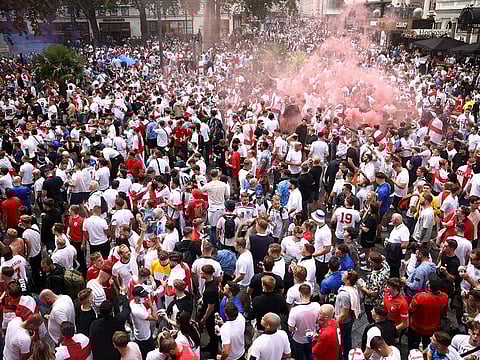 England fans gather in Leicester Square ahead of the Euro Cup final match between Italy and England on July 11, 2021. 