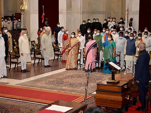 India's newly sworn in ministers pose with Indian Prime Minister Narendra Modi at the Presidential Palace in New Delhi, India