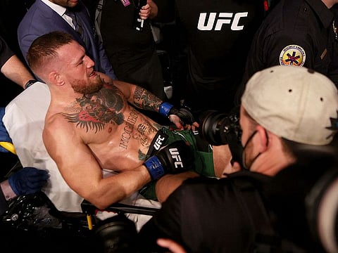 Conor McGregor is carried out of the UFC arena in Las Vegas after breaking his leg against Dustin Poirier