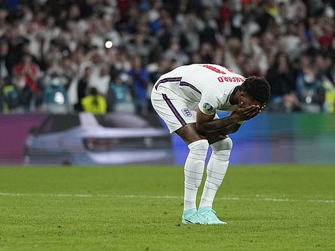 England's forward Marcus Rashford reacts after missing his penalty against Italy in the Euro 2020 final. 
