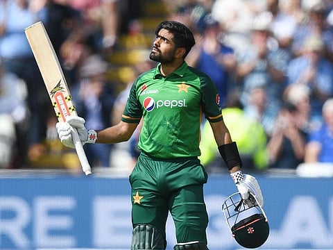 Pakistan's Babar Azam celebrates reaching his century.