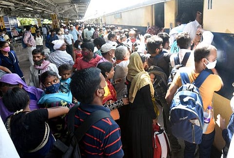 People board a train after relaxation in COVID-19 restrictions in Patna on July 14.