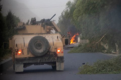 Humvees that belong to Afghan Special Forces are seen destroyed during heavy clashes with Taliban during the rescue mission of a police officer besieged at a check post, in Kandahar province on July 13, 2021. 