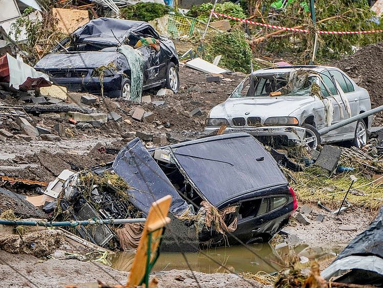 Damaged cars lie on the banks of the Ahr river in Schuld, Germany. 