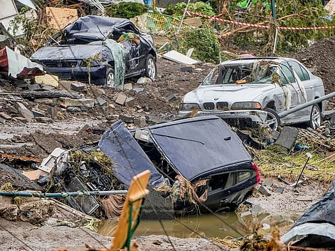 Damaged cars lie on the banks of the Ahr river in Schuld, Germany. 