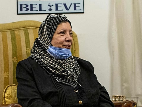 Amina Gaafar, a 58-year-old retired Egyptian social worker who has been saving for 30 years to "go to meet God", speaks during an interview with AFP at her house in Egypt's capital Cairo.