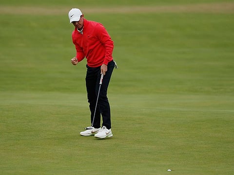 Northern Ireland's Rory McIlroy celebrates after a birdie on the 18th hole during the first round of The Open