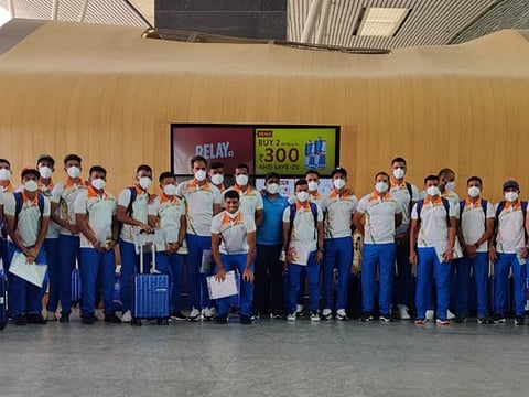 Tokyo beckons: Indian men's hockey team line up at the Bengaluru airport on Saturday on their way to New Delhi. The Indian contingent will head off to Tokyo later in the evening.