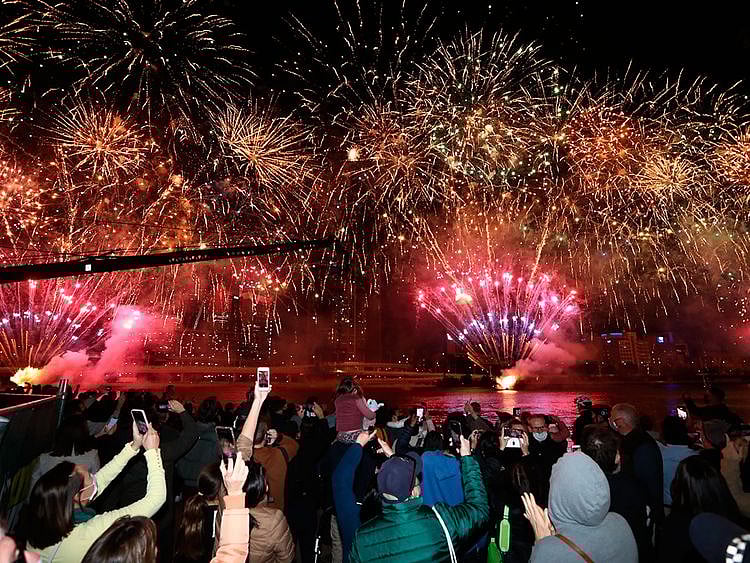 People celebrate in Brisbane following an announcement by the International Olympic Committee that Brisbane was picked to host the 2032 Olympics. 