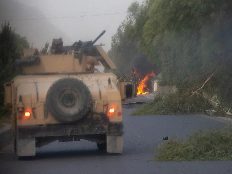  Humvees that belong to Afghan Special Forces are seen destroyed during heavy clashes with Taliban during the rescue mission of a police officer besieged at a check post, in Kandahar province, Afghanistan, July 13, 2021. 