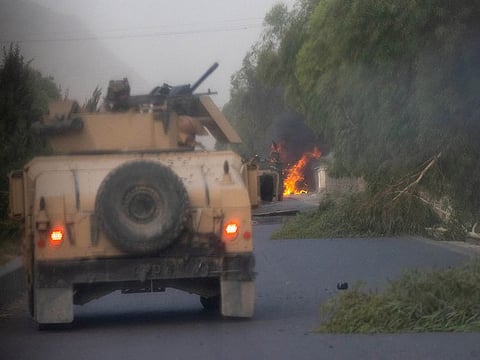  Humvees that belong to Afghan Special Forces are seen destroyed during heavy clashes with Taliban during the rescue mission of a police officer besieged at a check post, in Kandahar province, Afghanistan, July 13, 2021. 