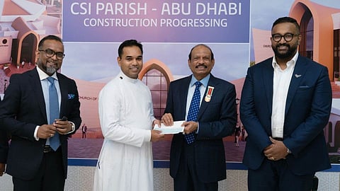 Yusuffali MA, chairman of Lulu Group, hands over a cheque for Dh500,000 to Rev Lalji M. Philip, Vicar of CSI Parish, in the presence of Ashish Koshy, member of CSI, and V. Nandakumar, communications director of Lulu Group.