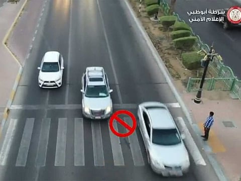 A screen grab of Abu Dhabi Police video posted on its twitter account warning motorists that they must stop at the pedestrian crossings to allow people cross the road. 