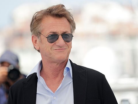 Sean Penn poses for photographers at the photo call for the film 'Flag Day' at the 74th international film festival, Cannes, southern France, Sunday, July 11, 2021.