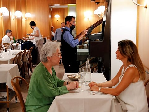 People dine at a restaurant as the Italian government announced limited restrictions for people who have not been vaccinated, including barring them from being served in indoor restaurants or from entering discos, gyms and sports stadiums on July 22, 2021. 