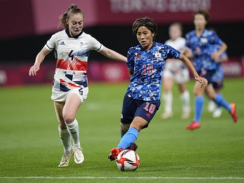 Britain's Keira Walsh, left, and Japan's Mana Iwabuchi compete for the ball during the women's soccer match at the 2020 Summer Olympics in Sapporo, Japan. 