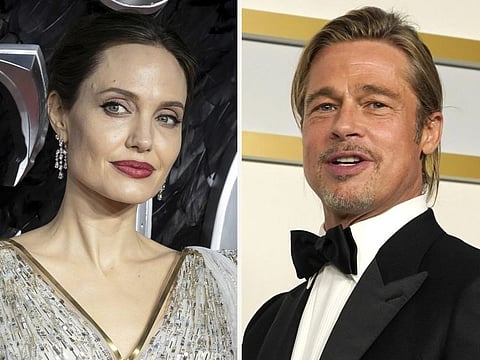 In this combination photo, Angelina Jolie, left, and Brad Pitt
