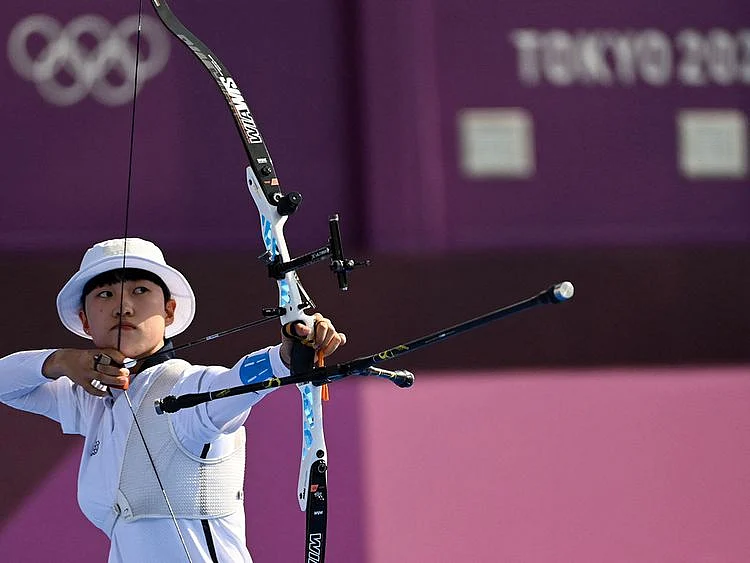 South Korea's An San competes in the mixed team event Yumenoshima Park Archery Field 