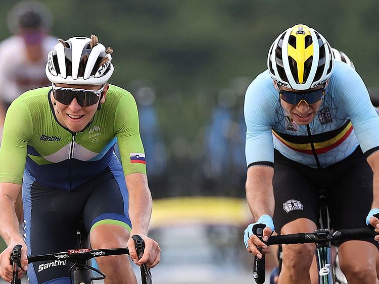 UAE Team Emirates' Tadej Pogacar of Slovenia and Wout van Aert of Belgium sprint for the line in the men's cycling road race at Tokyo 2020
