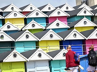 Splash of colour: UK beach huts brighten pandemic gloom