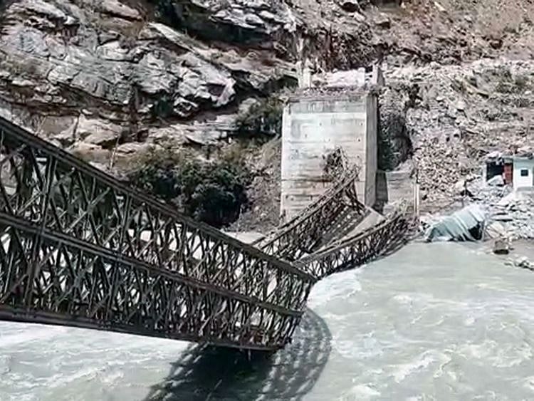 Bridge damaged on Sangla - Batseri road in Kinnaur after the big boulders hit the bridge, on Sunday.