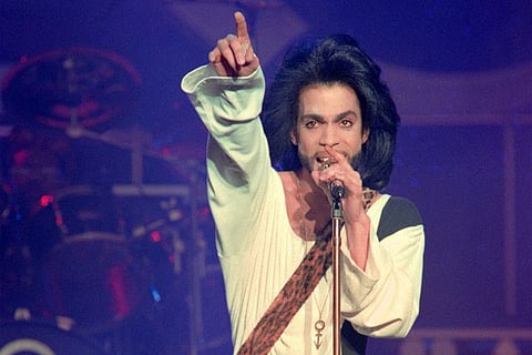  In this file photo taken on June 16, 1990, musician Prince performs on stage during his concert at the Parc des Princes stadium in Paris. - Prince's estate will soon issue a completed record from the mercurial artist's storied music vault, the first never-before-heard album released since the musician's shock death five years ago. "Welcome 2 America" -- a 12-track album finished in 2010, but shelved for reasons unknown, in the famous vault at Prince's Paisley Park compound near Minneapolis.