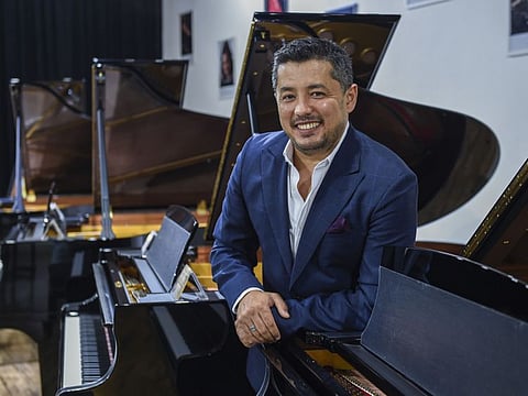 Shavkat Mamadjonov, Founder and CEO of House of Pianos, at the showroom in Al Quoz, Dubai. 