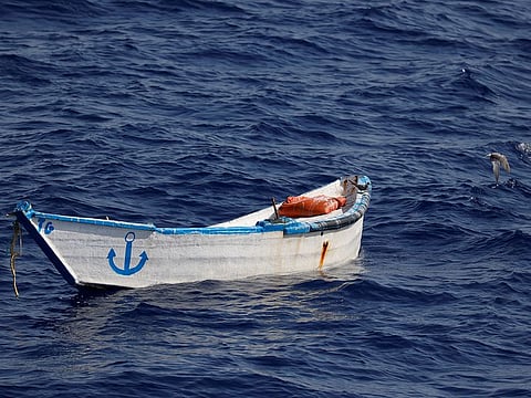 Birds fly off an abandoned wooden boat, seen from the German NGO migrant rescue ship Sea-Watch 3 in the search and rescue zone off the North African coast, in the western Mediterranean Sea, July 26, 2021. 