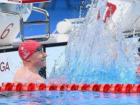 Britain's Tom Dean celebrates after winning the final of the men's 200m freestyle 