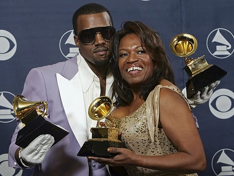 Kanye West  and his mother Donda hold his three awards backstage at the 48th Annual Grammy Awards on Feb. 8, 2006, in Los Angeles.
