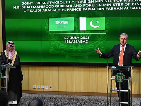 Pakistan's Foreign Minister Shah Mahmood Qureshi (R) and Saudi Foreign Minister Prince Faisal Bin Farhan Al-Saud (L) speak during a joint press conference at the Foreign Ministry in Islamabad on July 27, 2021. 